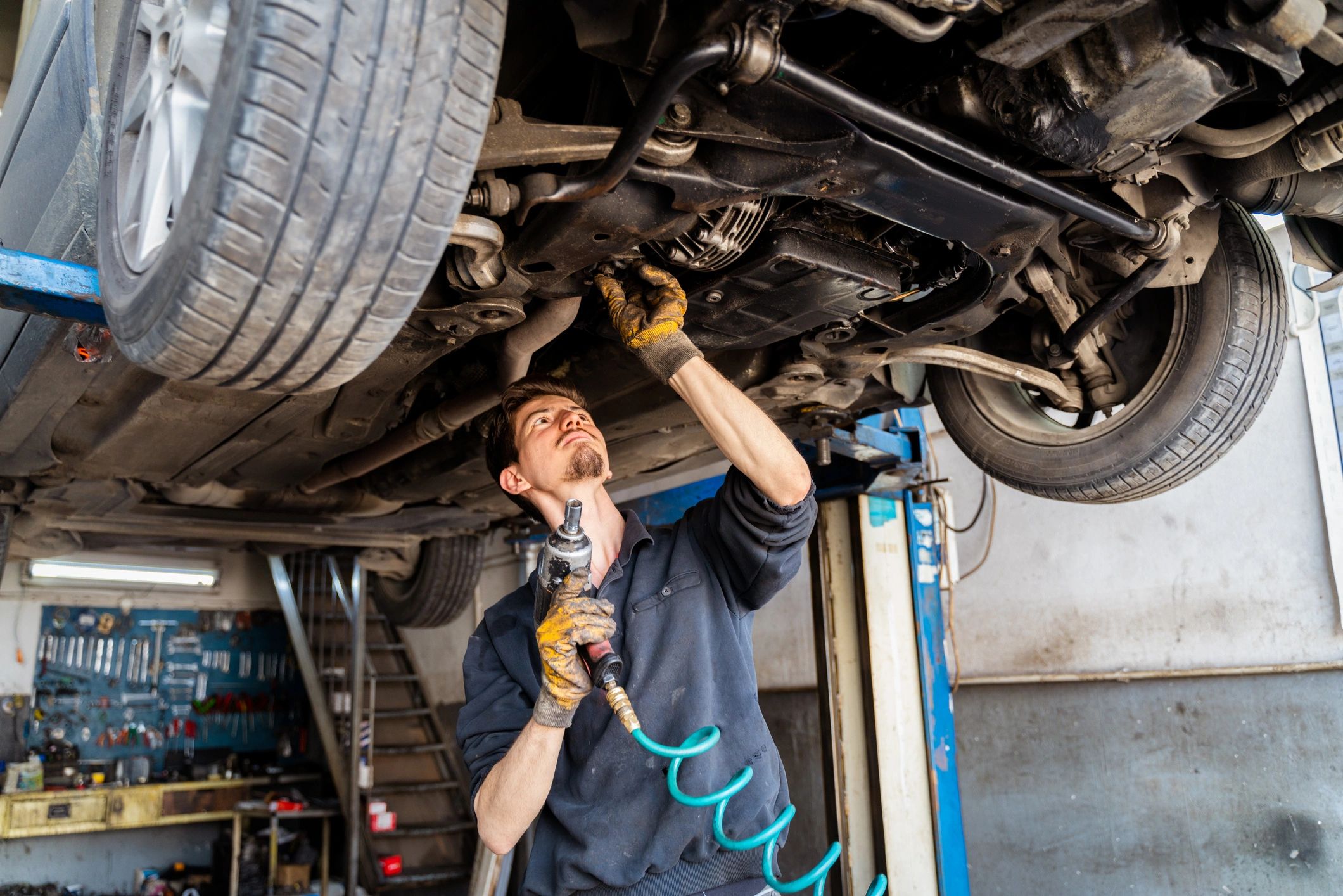 Car mechanic working in an auto repair shop