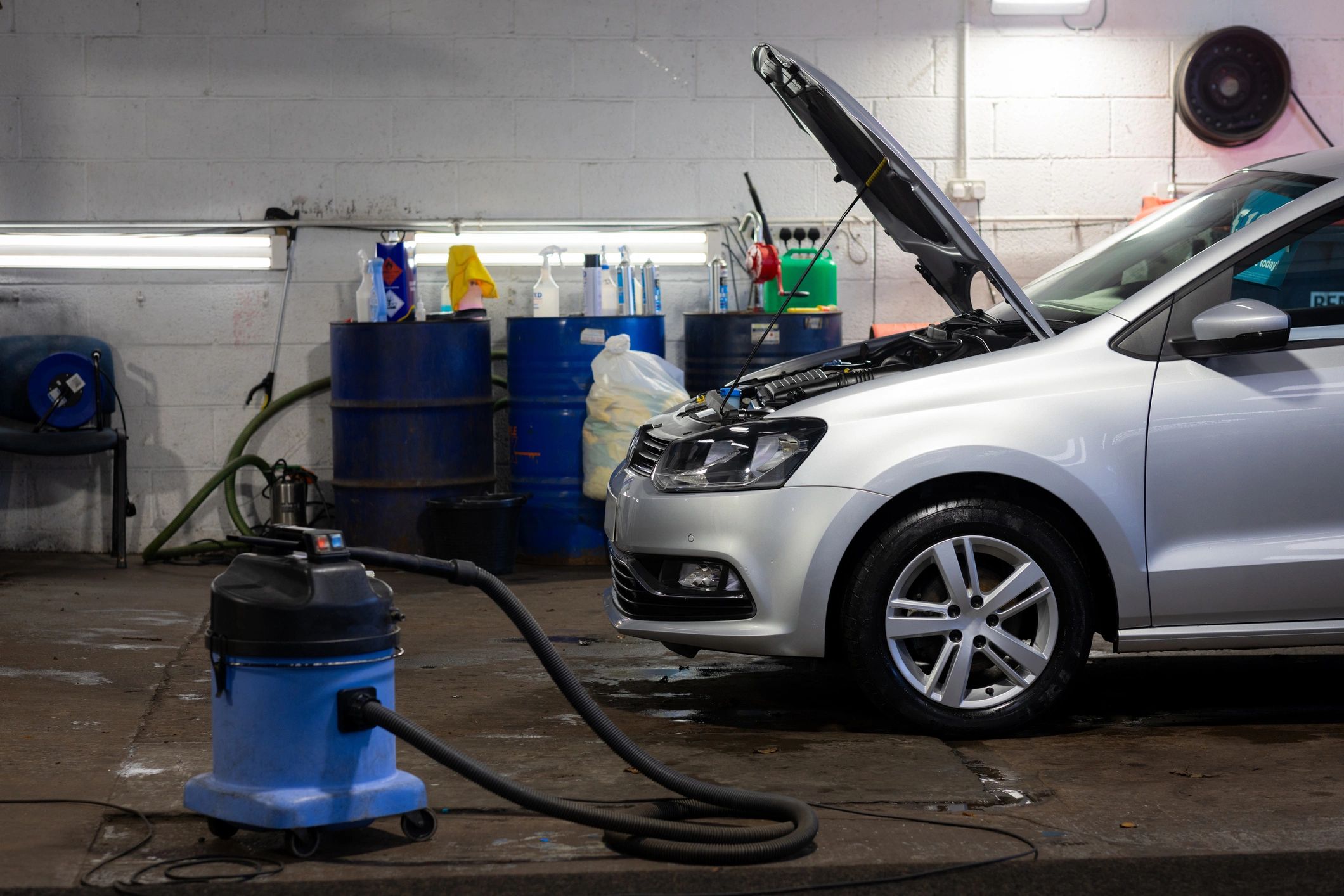 Car being serviced inside a garage
