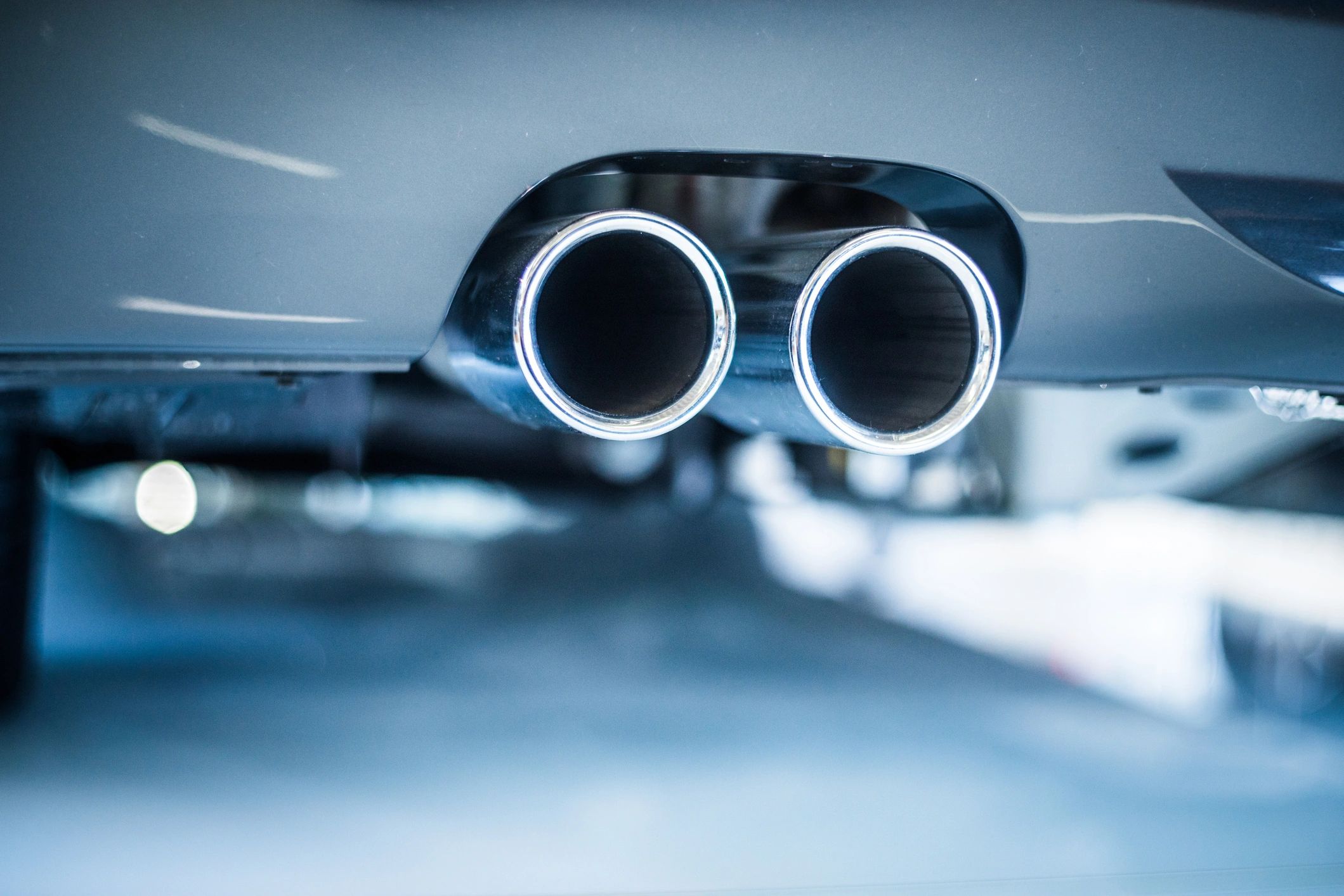 Sportscar exhaust pipes viewed from below